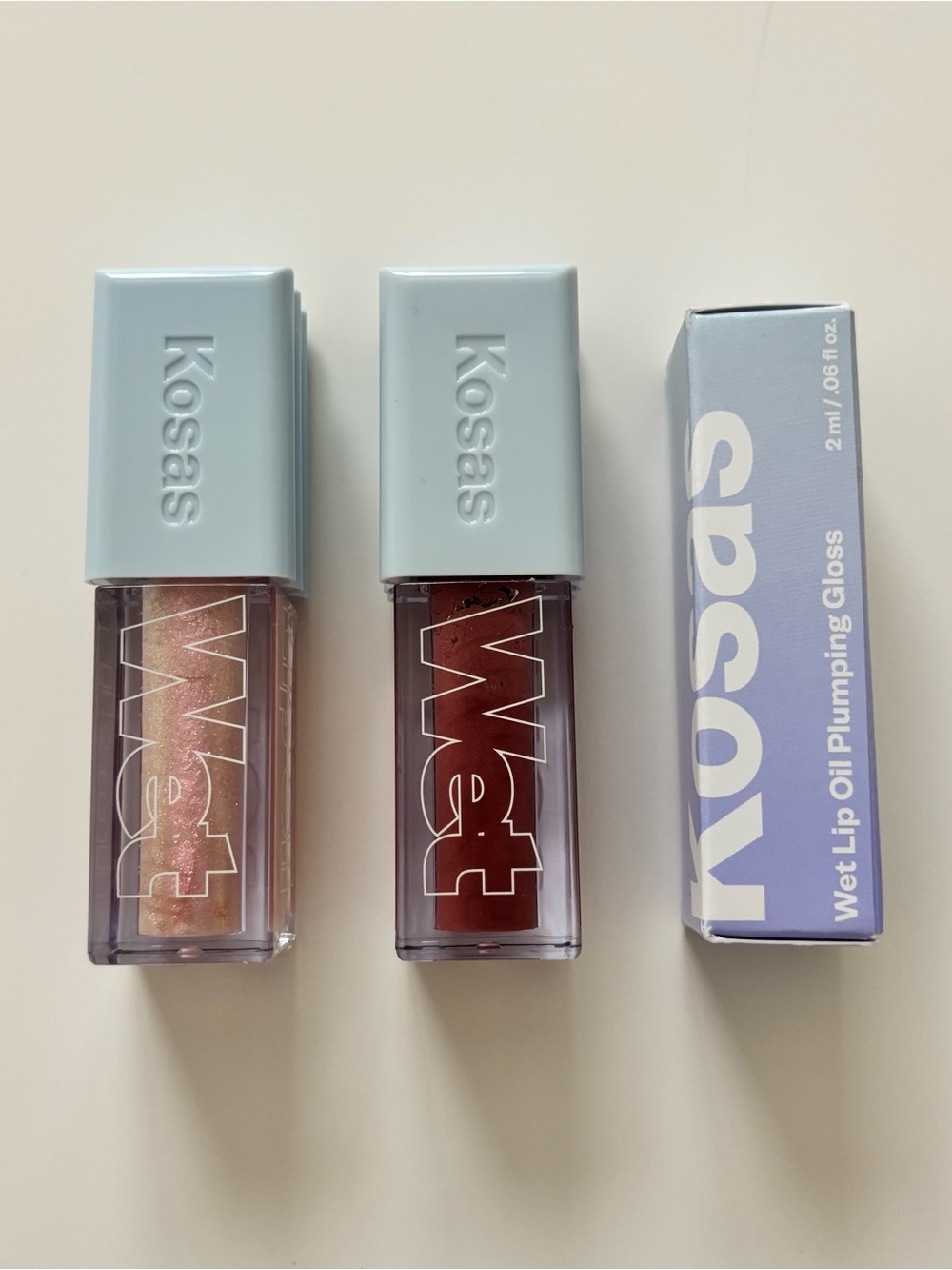 Kosas Wet Lip Oil Plumping Gloss in Unbuttoned, Exposed, and Jellyfish